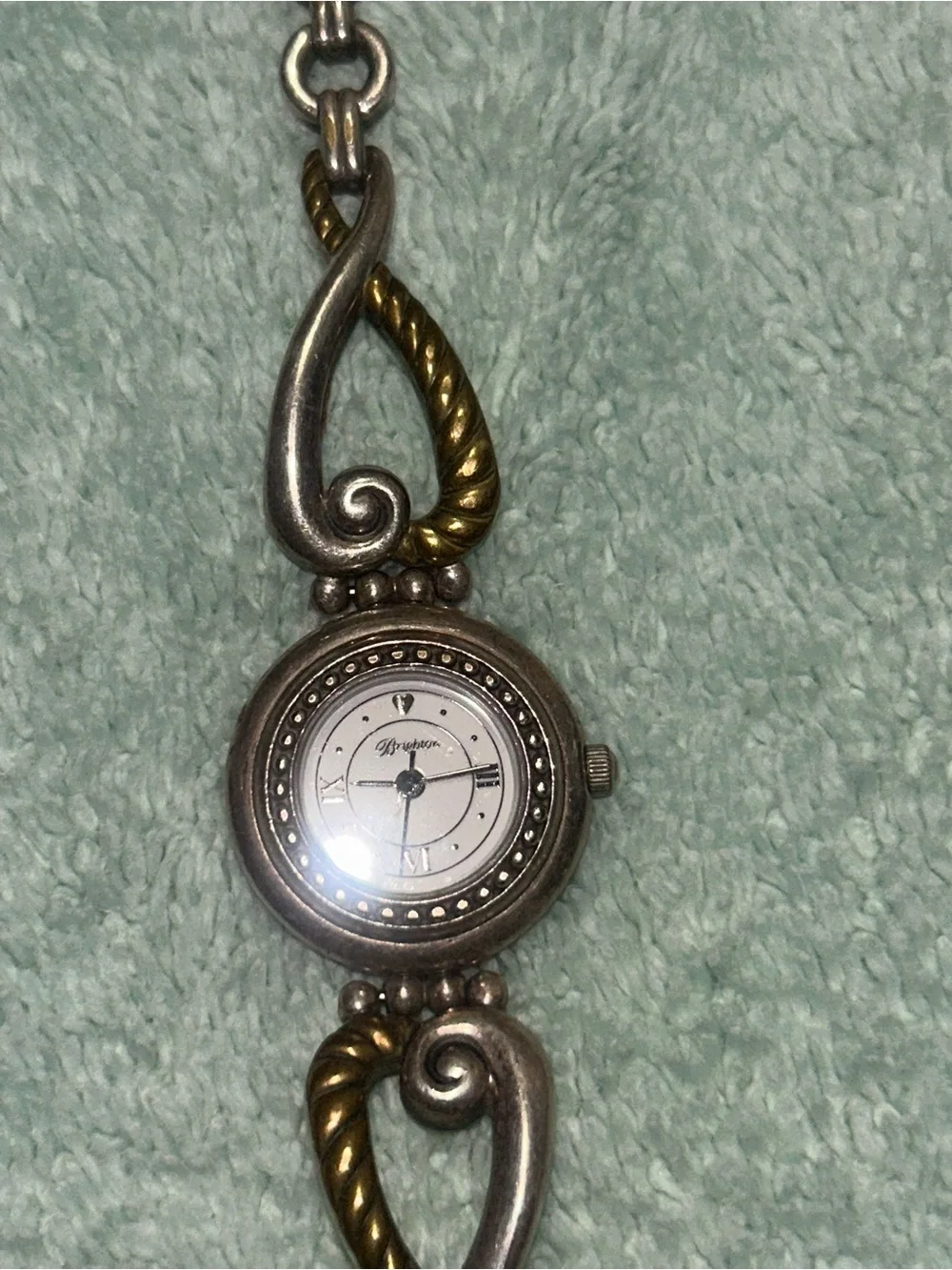 two-tone Brighton Charleston Watch featuring a round white face. RETIRED